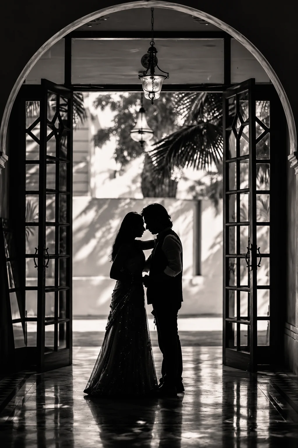 Couple silhouette under an arched doorway